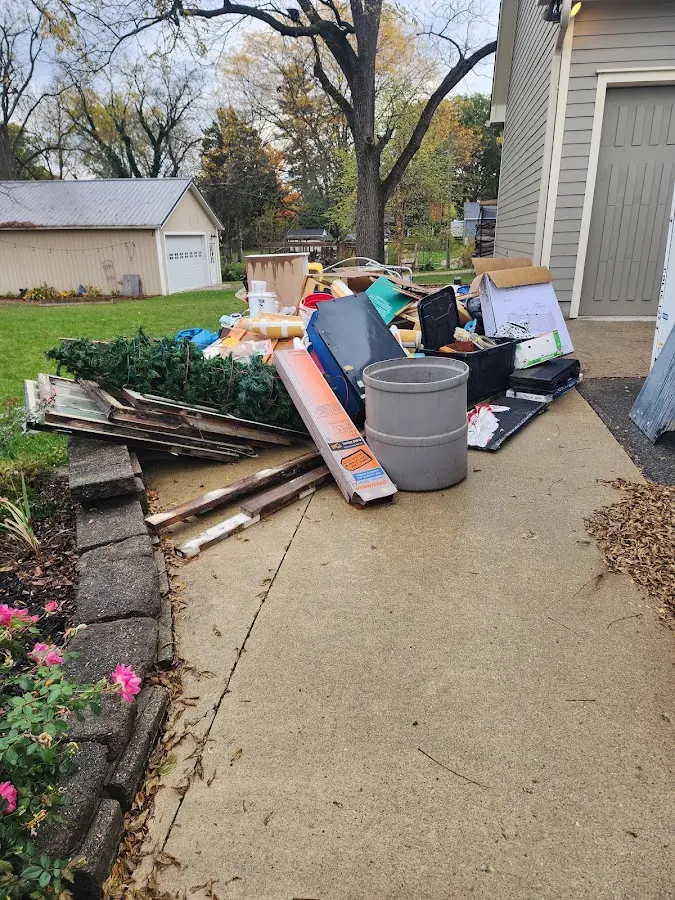 Dumpster being loaded with debris for 12 Yard Dumpster Rental in East Coventry